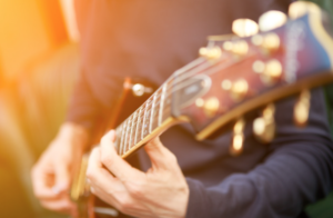 Guitar player playing an electric guitar.