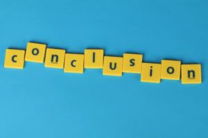 Yellow blocks letters on a blue background spelling out th words conclusion.