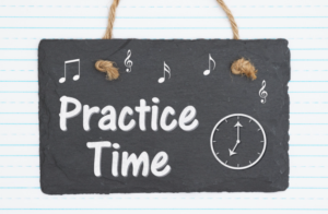 A black piece of paper with a clock and the words Practice Time written on it.